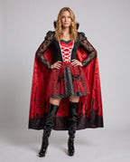 Women's vampire Halloween costume with lace sleeves and red graveyard-print cape