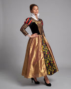 Women's queen Halloween costume with black velvet bodice, gold lace sleeves, white stand-up collar and full gold skirt with heart-print panel