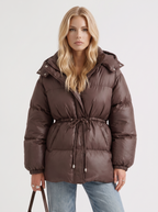Brown women's puffer jacket with hood and cinched tie waist