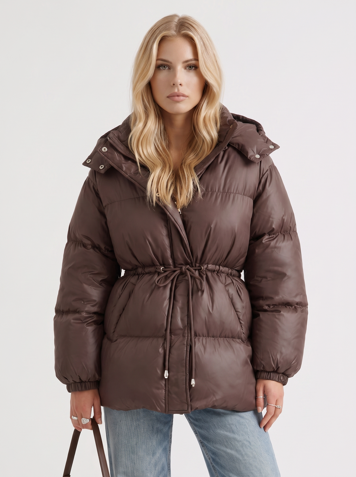 Brown women's puffer jacket with hood and cinched tie waist