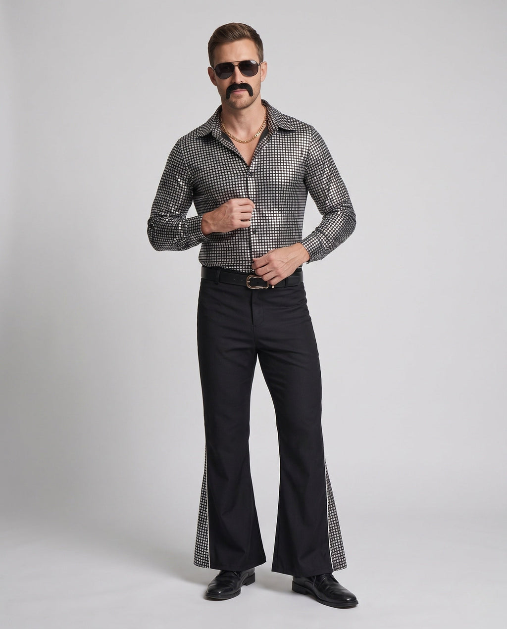 Men's disco costume with metallic silver square-print shirt and black flared pants