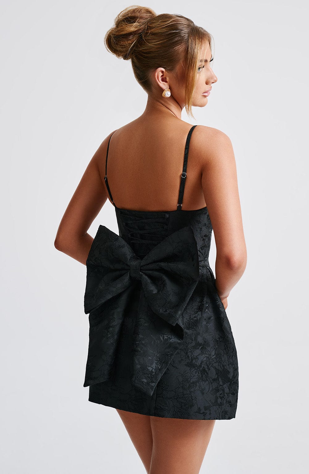 Black floral jacquard homecoming mini dress with plunging V neckline, lace-up back and oversized back bow - view 5