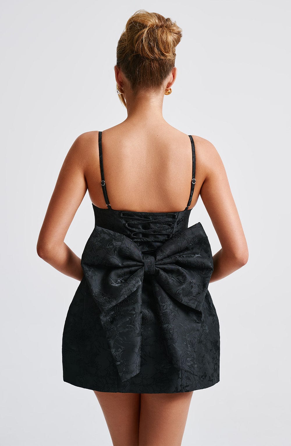 Black floral jacquard homecoming mini dress with plunging V neckline, lace-up back and oversized back bow - view 6
