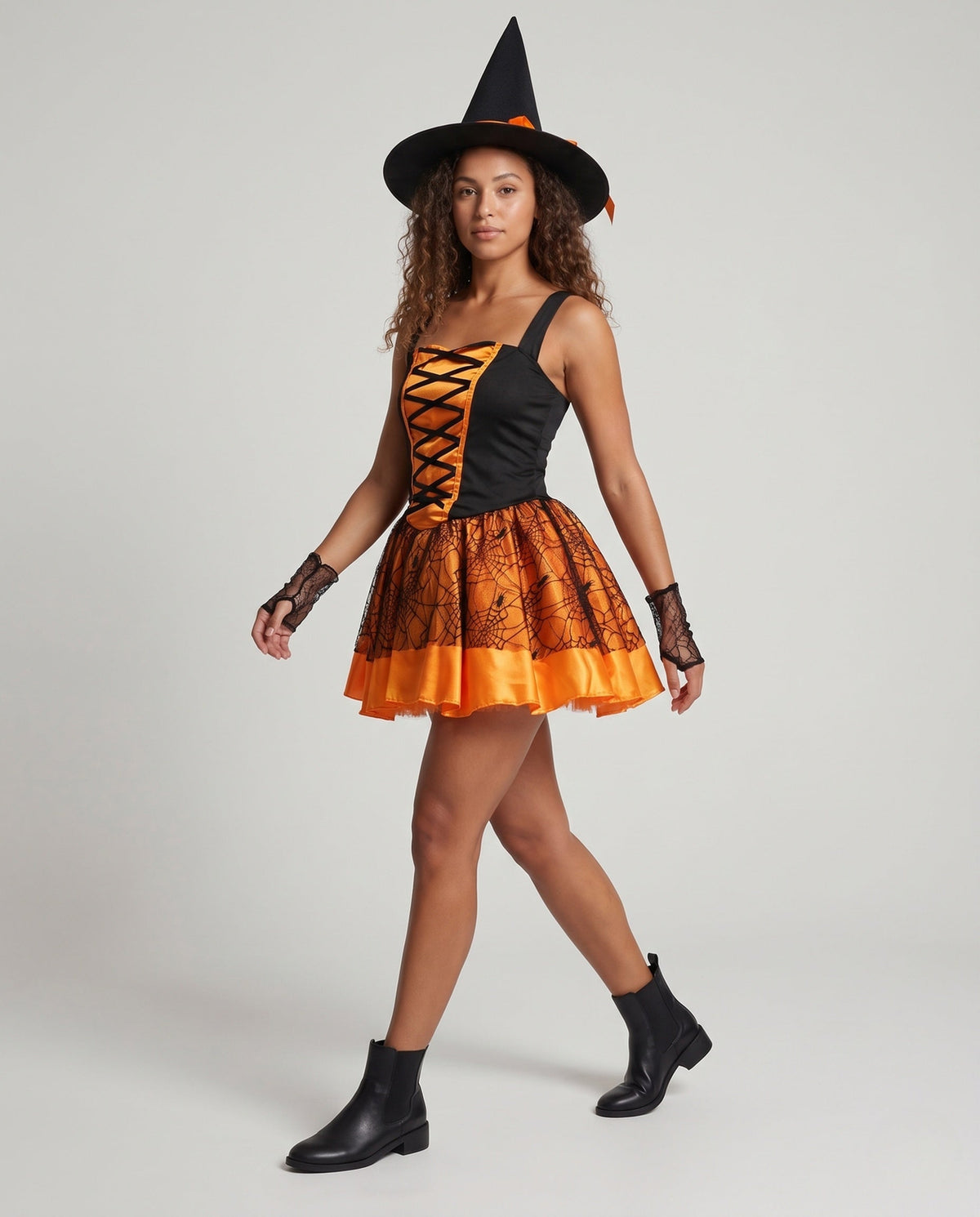 Women's witch Halloween costume with lace-up satin bodice, spiderweb mesh skirt, witch hat and lace arm sleeves