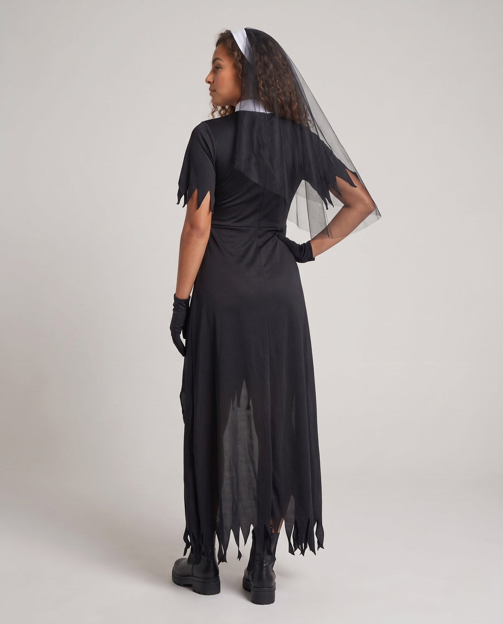 Women's gothic nun Halloween costume with a black tattered dress, white bib with red cross, and a veil - view 3
