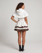 Women's white corset-style Halloween costume dress with plaid ruffle tiers, faux fur trim and hooded capelet - view 3