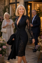Woman wearing a fitted tuxedo-collar cocktail dress with sheer lace sleeves and lace skirt panel - view 3