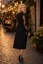 Woman wearing a fitted tuxedo-collar cocktail dress with sheer lace sleeves and lace skirt panel - view 5