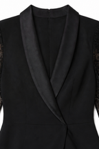 Woman wearing a fitted tuxedo-collar cocktail dress with sheer lace sleeves and lace skirt panel - view 7