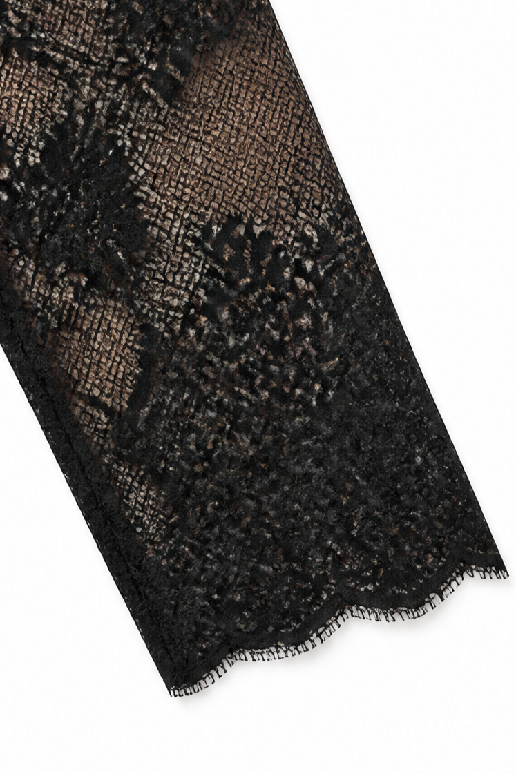 Woman wearing a fitted tuxedo-collar cocktail dress with sheer lace sleeves and lace skirt panel - view 8