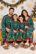 Matching family Christmas pajamas in green tree and snowflake print with red cuffs
