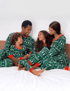 Matching family Christmas pajamas in green tree and snowflake print with red cuffs - view 12